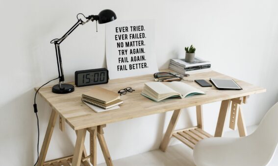 Desk set up with motivational poster on trying again